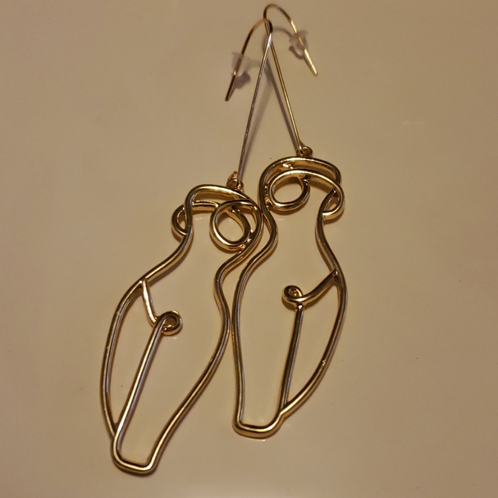 Gold statement body earrings